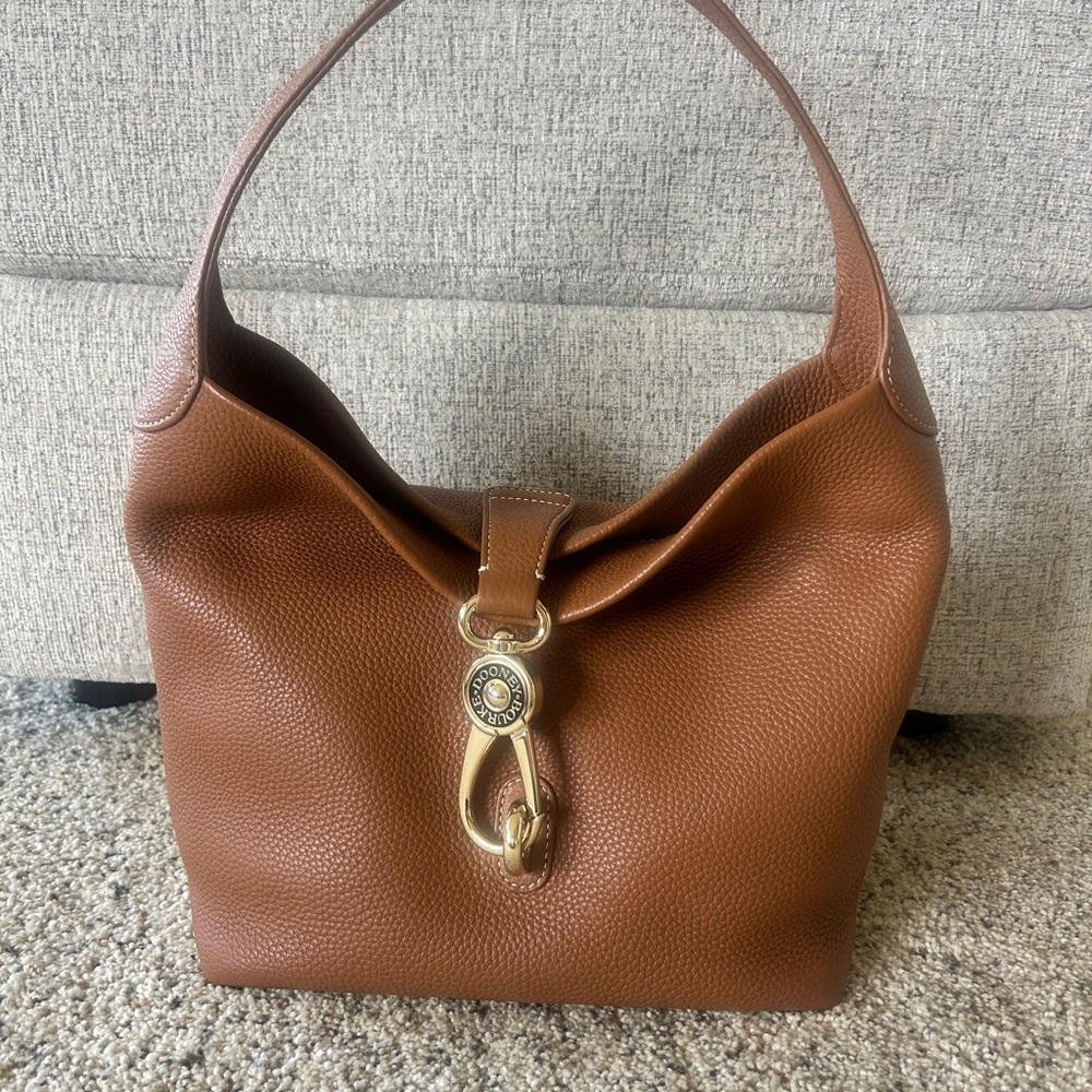 Dooney & Bourke Shoulder Logo Lock Sack with Gold Hardware.